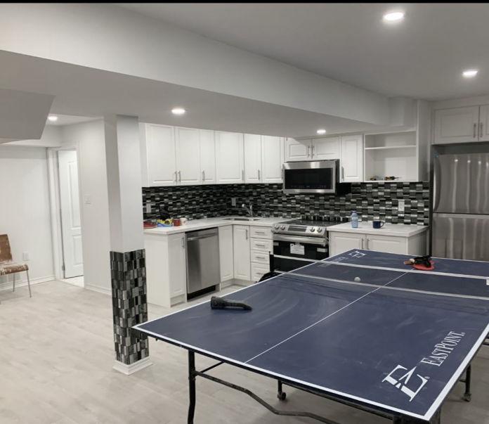 Custom kitchen remodeling with white cabinets and quartz countertops in NYC