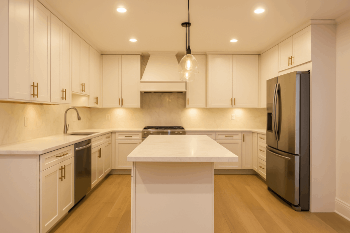 Modern kitchen renovation with flat-panel cabinets, marble countertops, and built-in appliances in NYC
